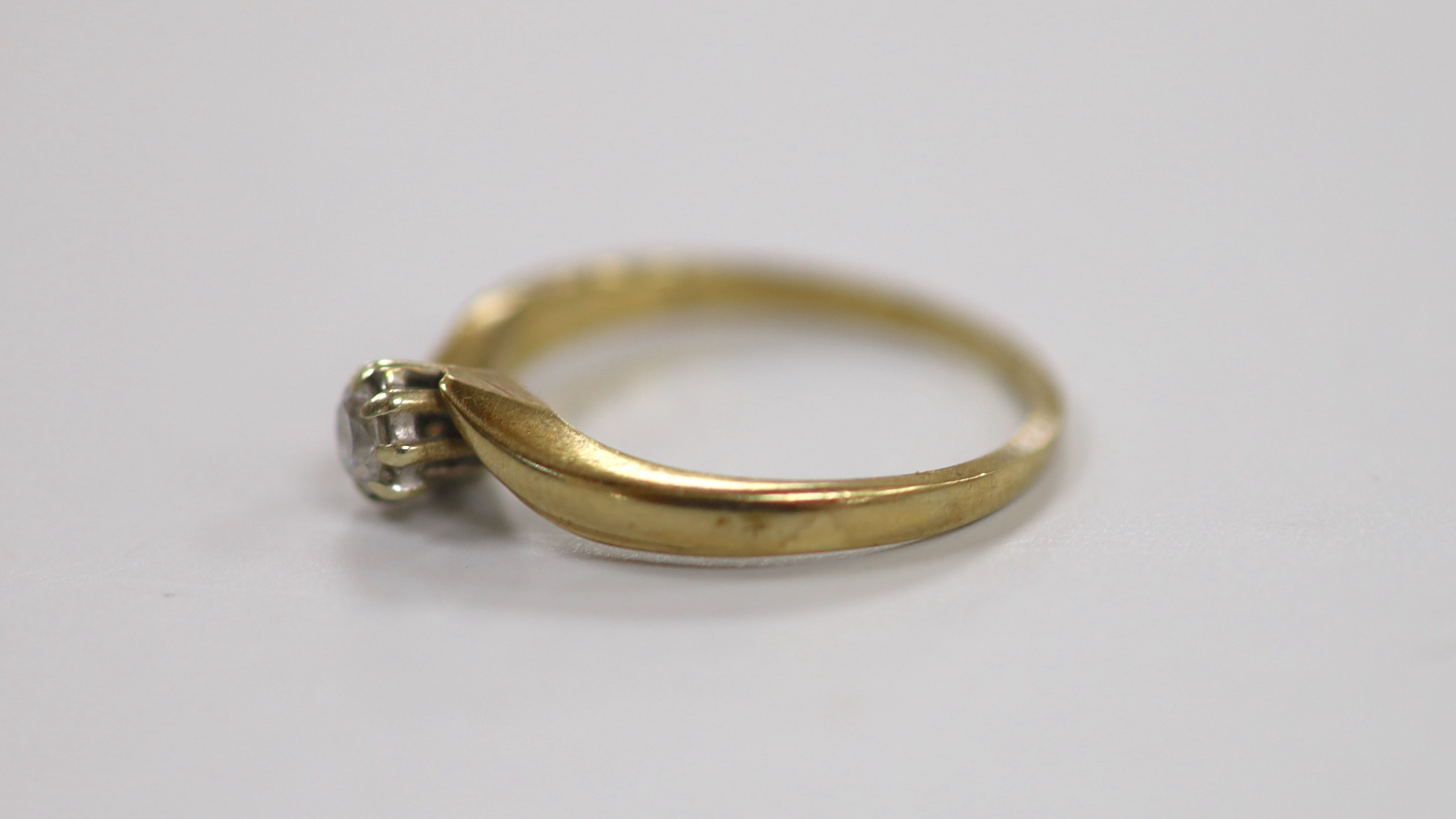A modern 9ct gold and solitaire diamond ring, size M, gross weight 1.9 grams.